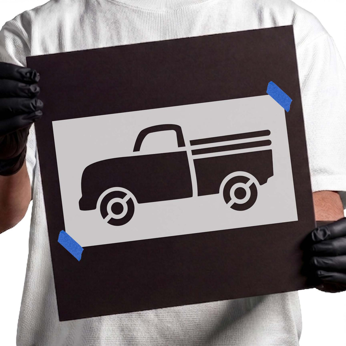 Vintage farm truck stencil featuring a rounded cab, circular wheels, and horizontal cargo bed rails