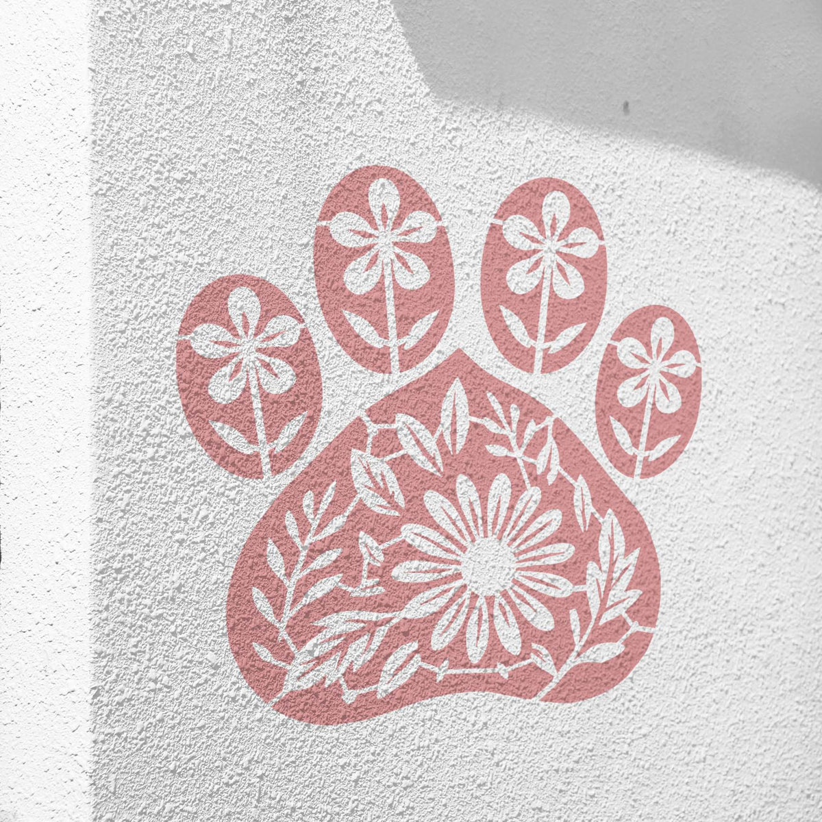 Soft pink Floral Dog Paw Print Stencil displays delicate blossoms across a textured white wall