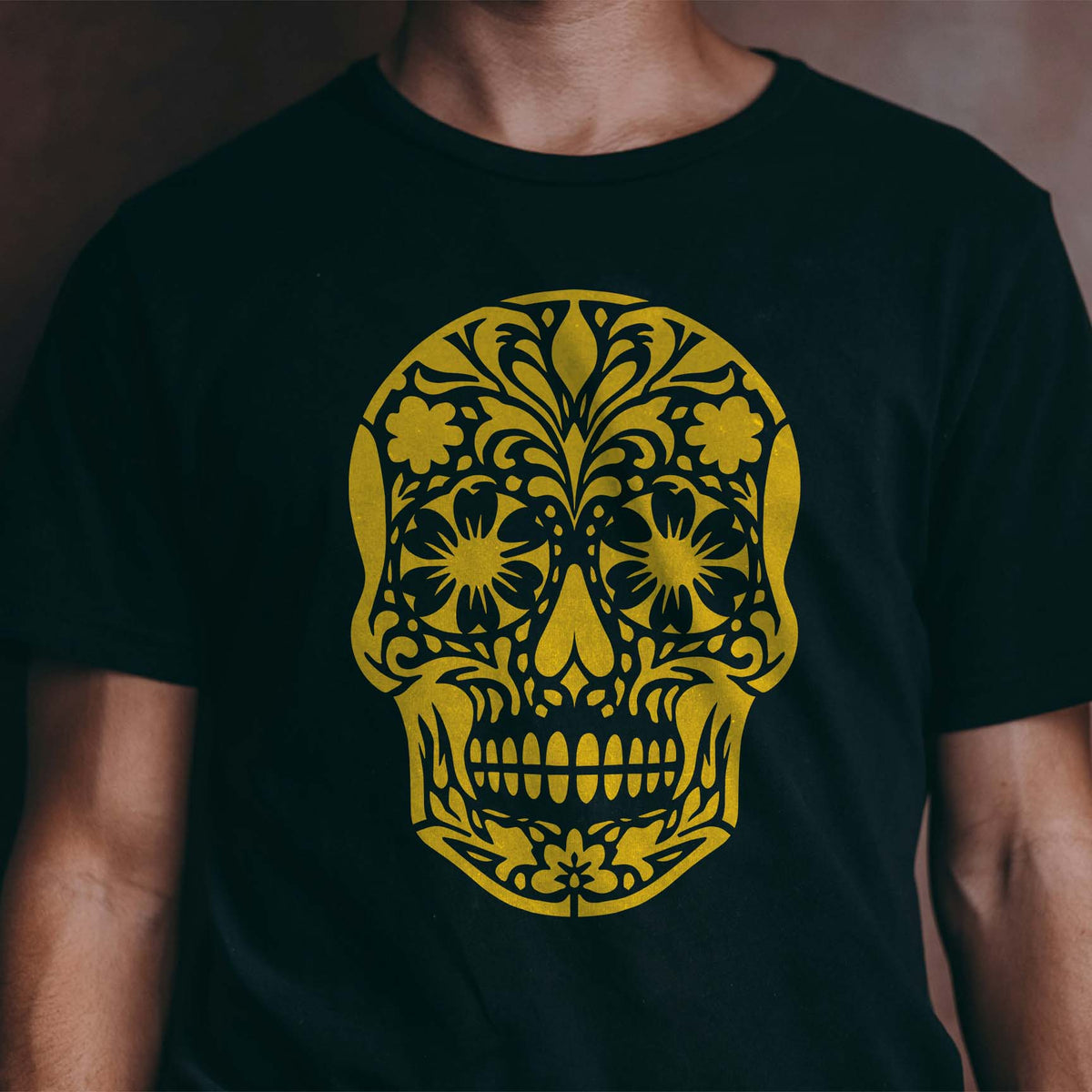 Golden Floral Sugar Skull Stencil stands boldly across the front of a black shirt