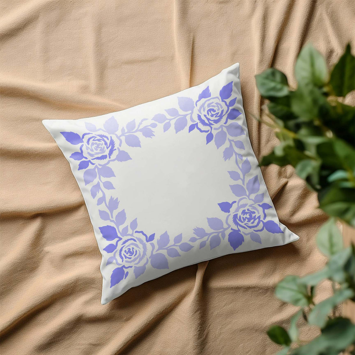Floral Wedding Border Stencil featuring four green roses and leafy vines forming a decorative square frame on a white pillow.