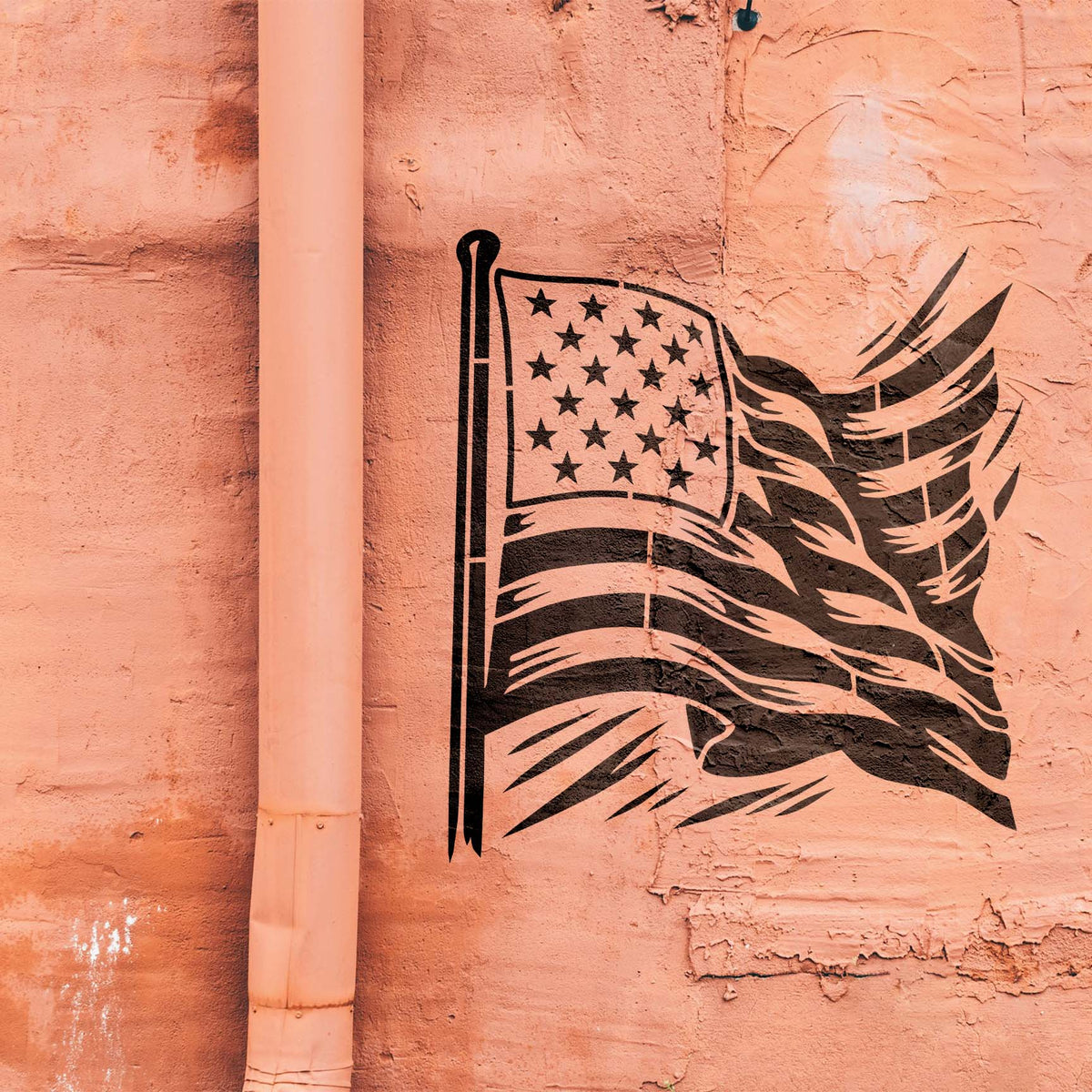 Bold black Flowing American Flag Stencil stretches across a weathered peach wall with rippling stripes