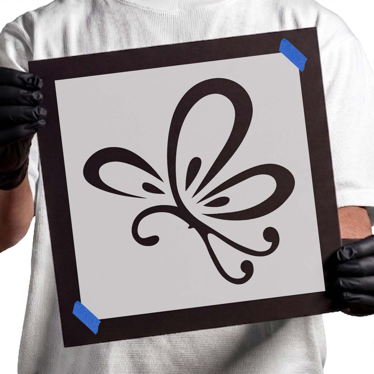 Flying butterfly stencil with elongated wings and curled decorative accents
