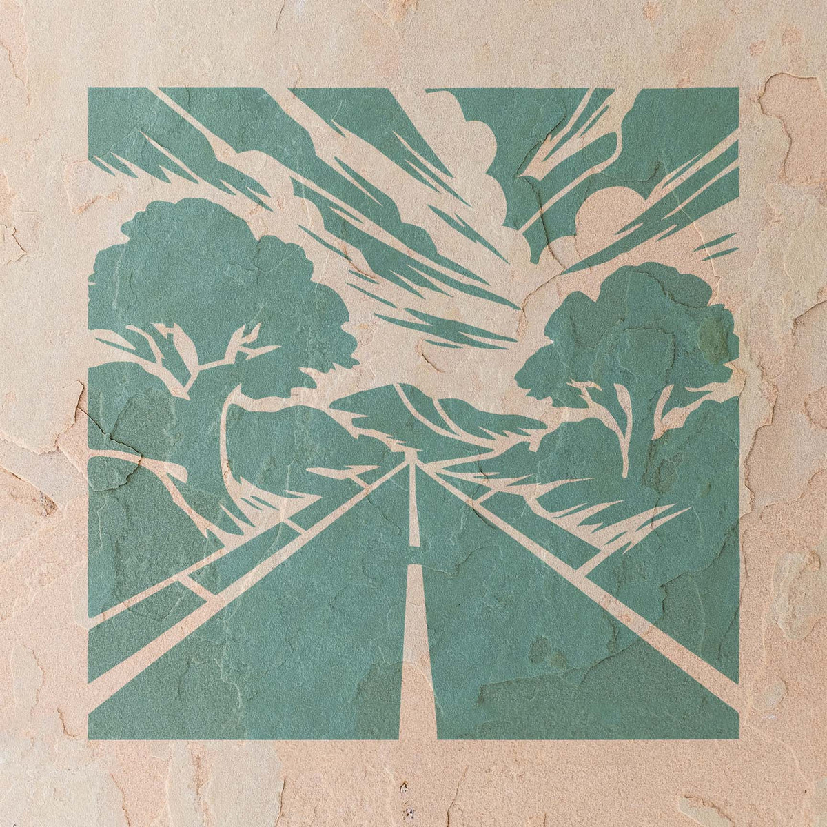 Forest Highway Horizon Stencil stretches toward distant hills beneath a dramatic sky on a textured stucco wall.