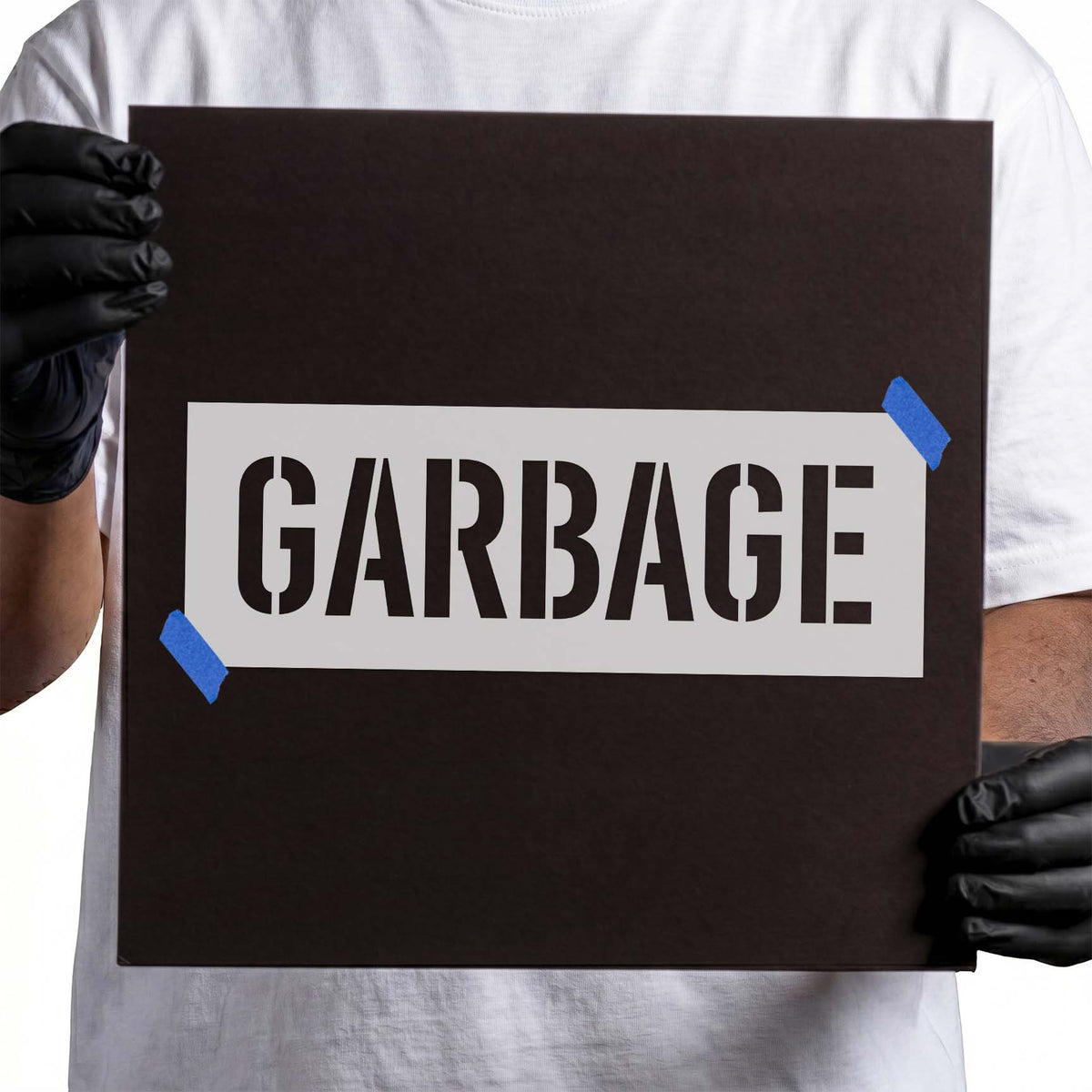 Garbage stencil featuring bold uppercase block lettering with distinctive stencil breaks