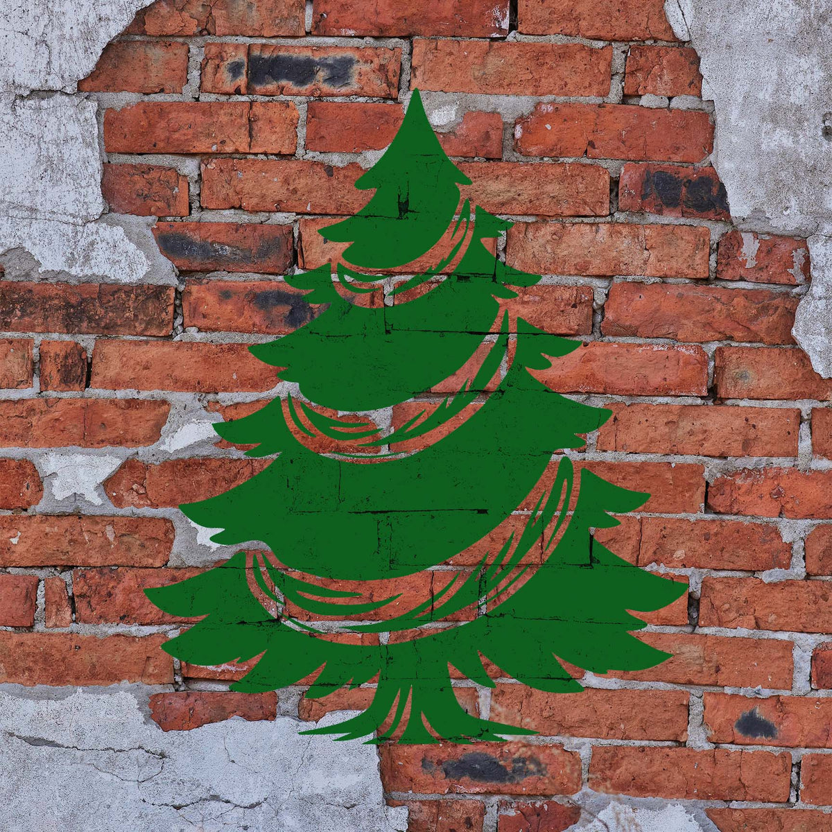 Garland Christmas Tree Stencil painted in green on a rustic brick wall.