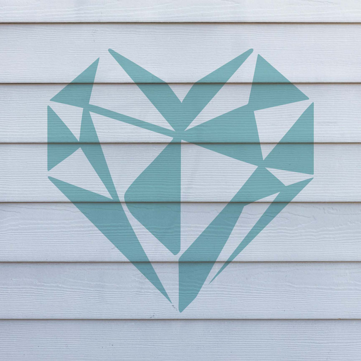 Geometric Heart Stencil creates a large blue faceted heart across white exterior siding
