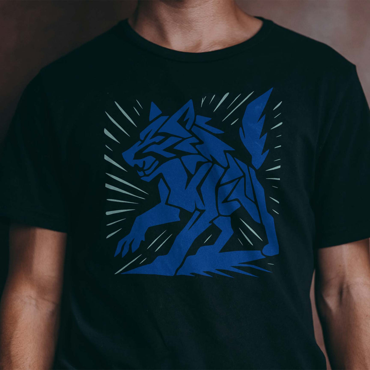 Geometric Wolf Stencil printed in blue on a black T-shirt with angular details