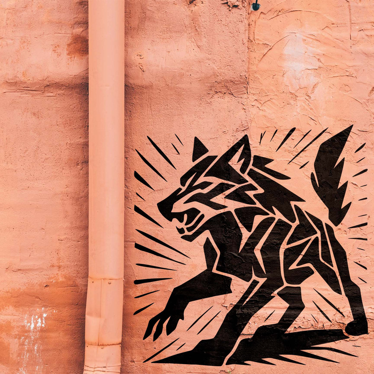 Bold black angles shape a snarling Geometric Wolf Stencil against a textured salmon-colored wall.