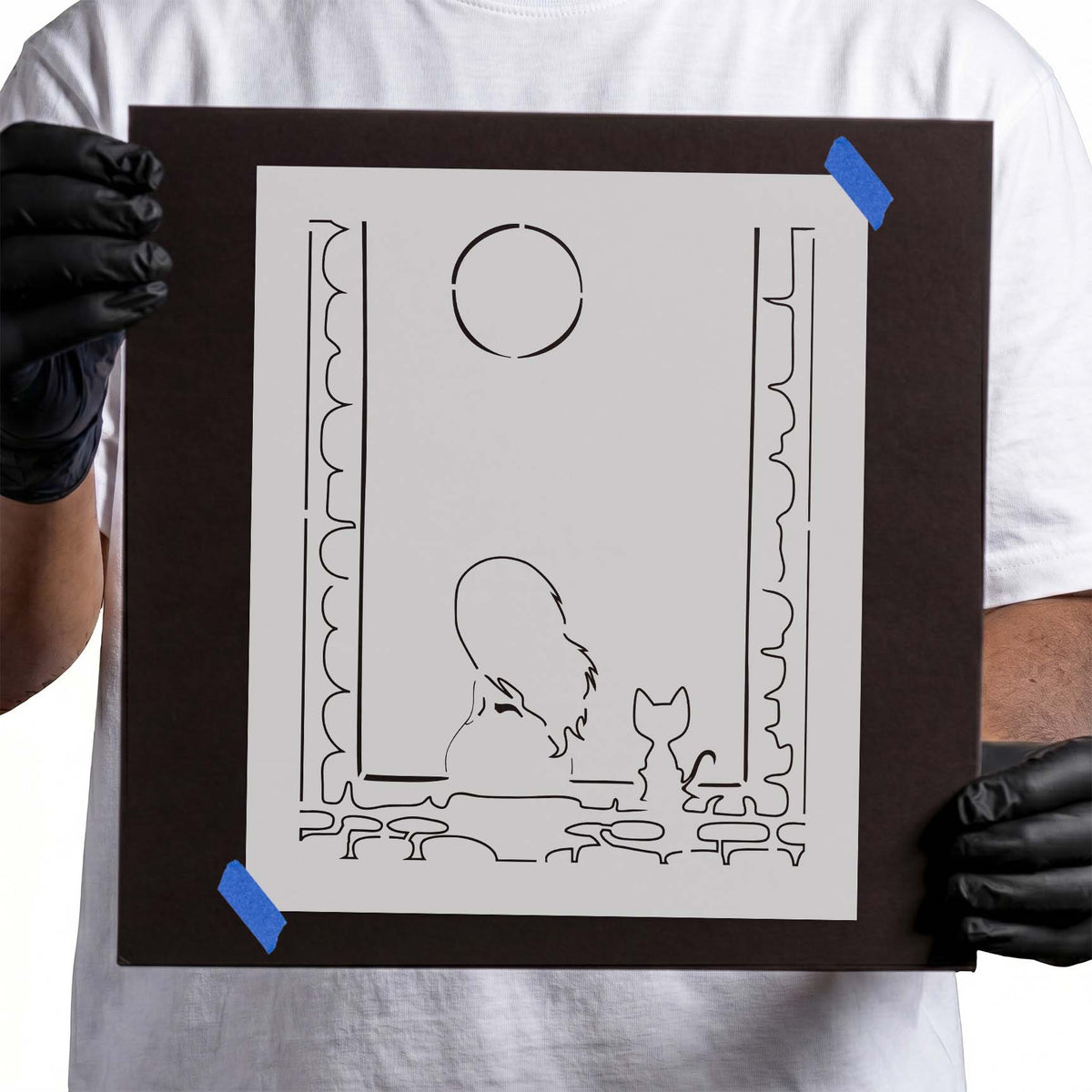 Girl and Cat Stencil depicting a girl and her feline companion at a window beneath a round moon