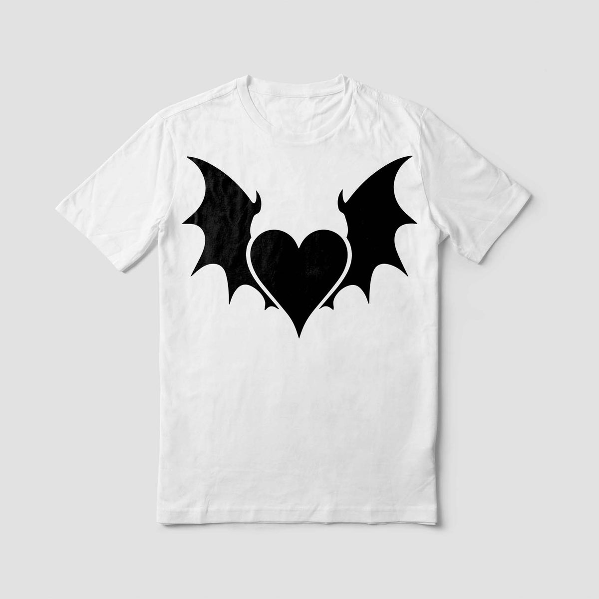 A white T-shirt showcases the Gothic Heart with Wings Stencil in a dramatic black bat-wing design