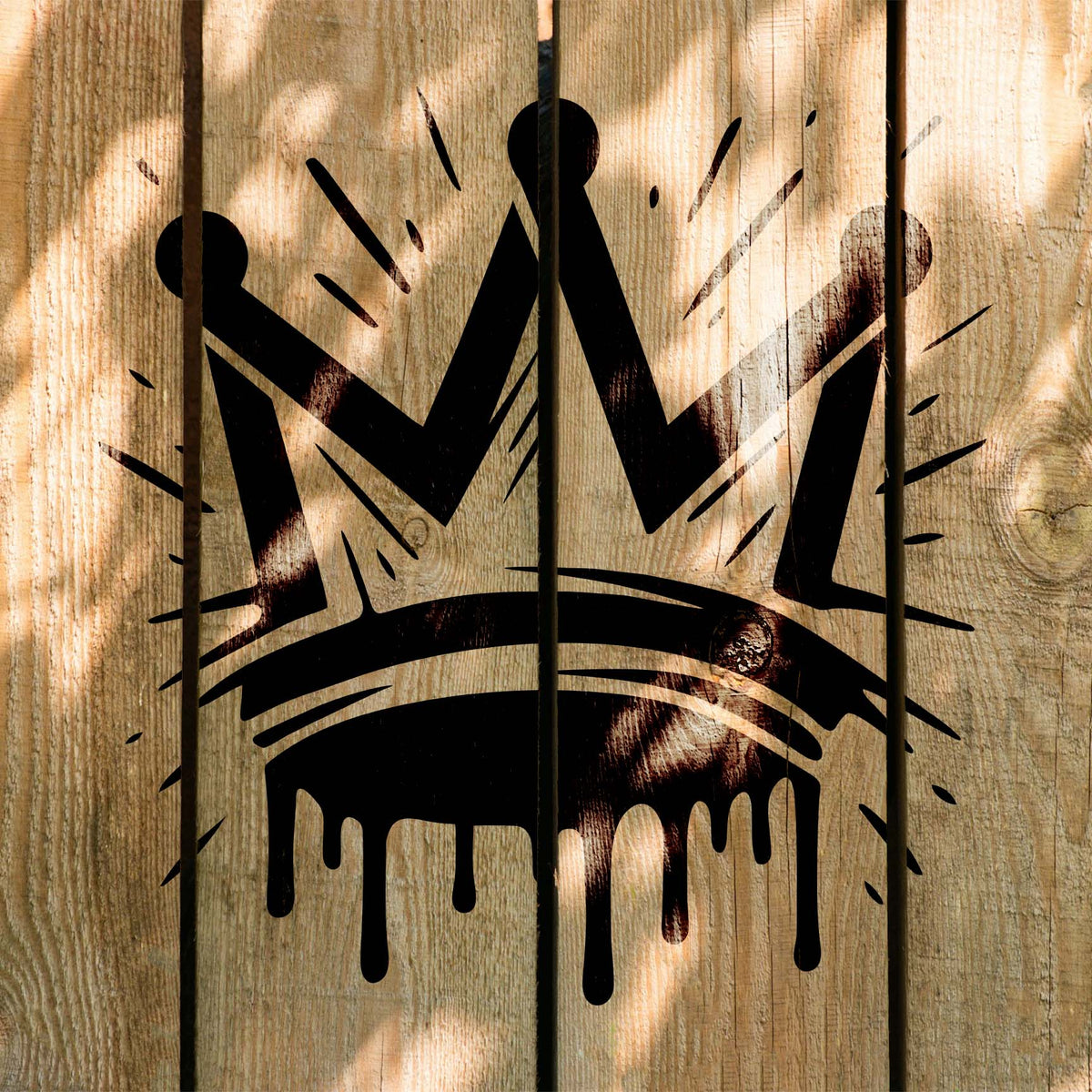 Displayed on wood planks, the Graffiti Crown Stencil adds a bold black crown with graffiti style.