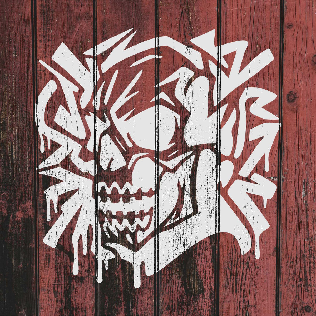 Graffiti Skull Stencil covers red wooden planks with a striking white skull and dripping accents