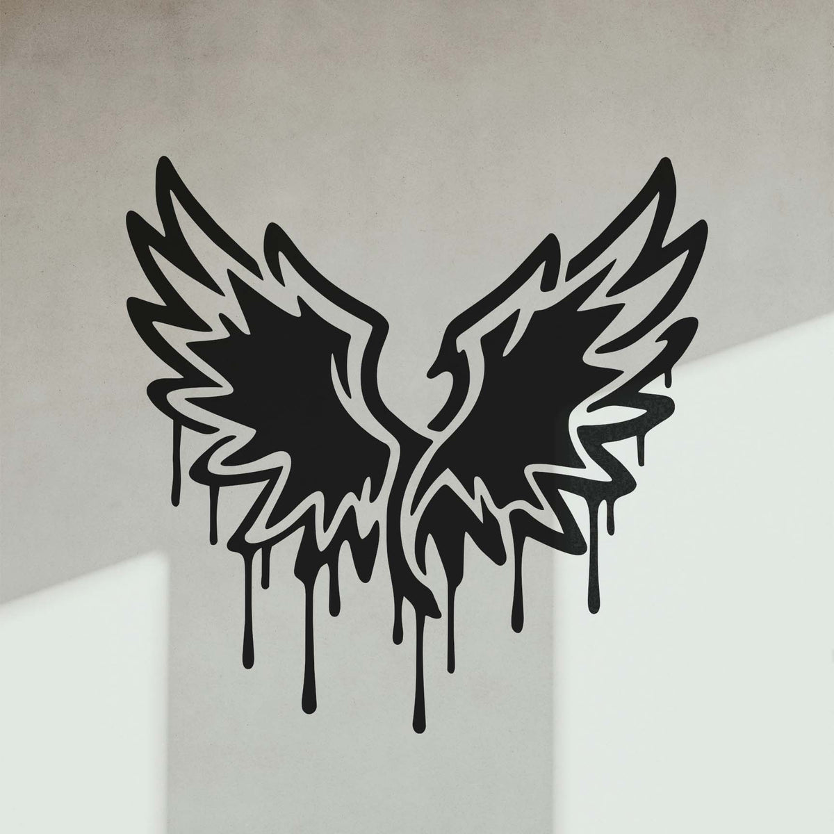 A striking pair of dripping black wings from the Graffiti Wings Stencil transforms a white wall into urban art.