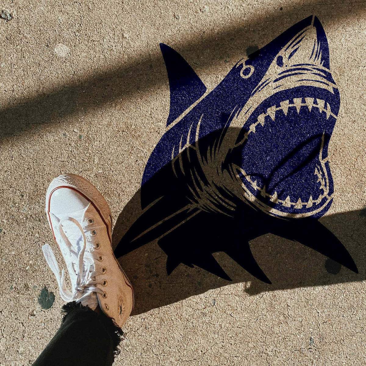 Great White Shark Attack Stencil makes a dramatic open-jaw impression across concrete