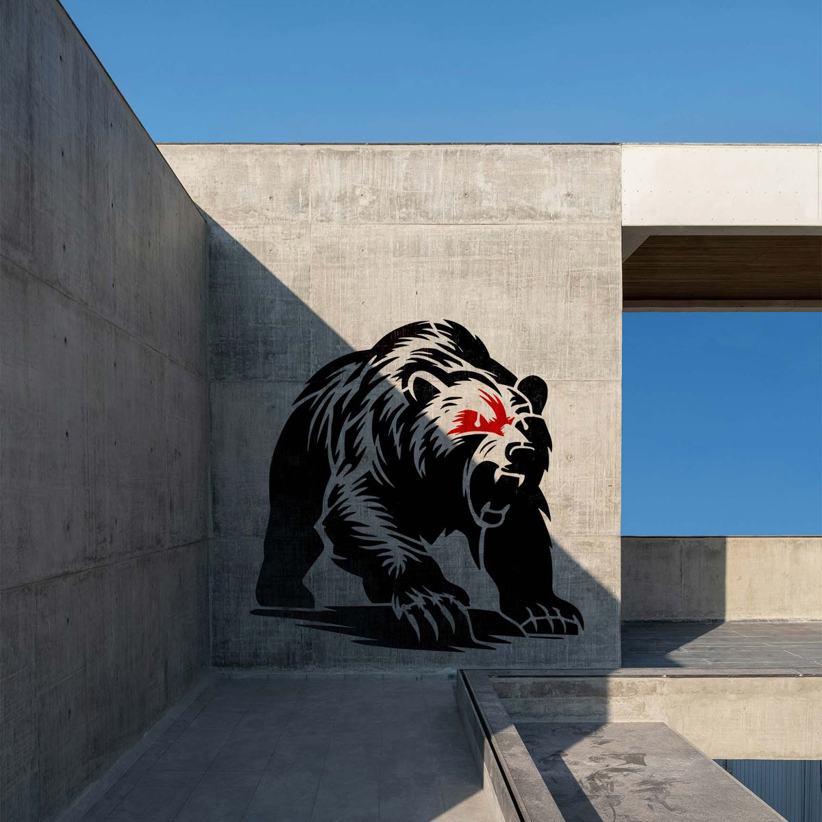 Roaring grizzly bear stencil with fierce red eyes painted on a concrete wall