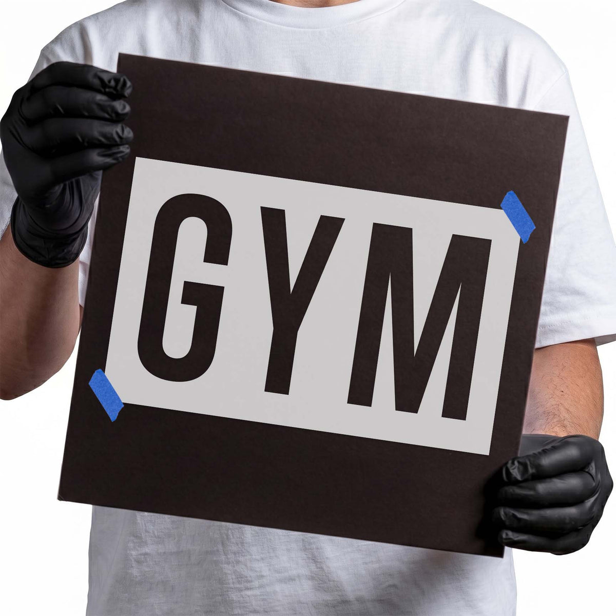 Gym text stencil featuring three oversized uppercase block letters with thick geometric strokes