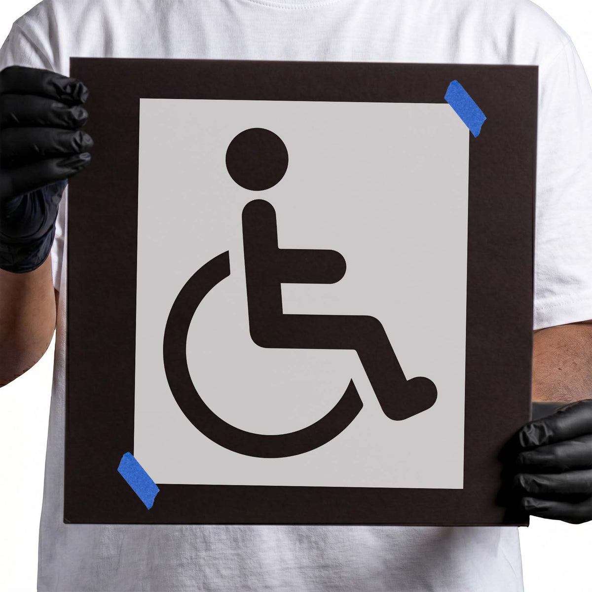 Wheelchair accessibility symbol stencil with bold figure and circular wheel