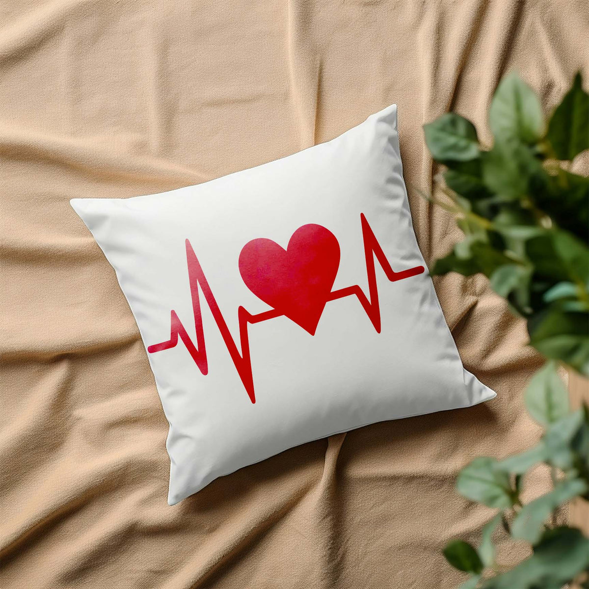 A white pillow displays the Heartbeat Heart Pulse Line Stencil with a vivid red heart and heartbeat line