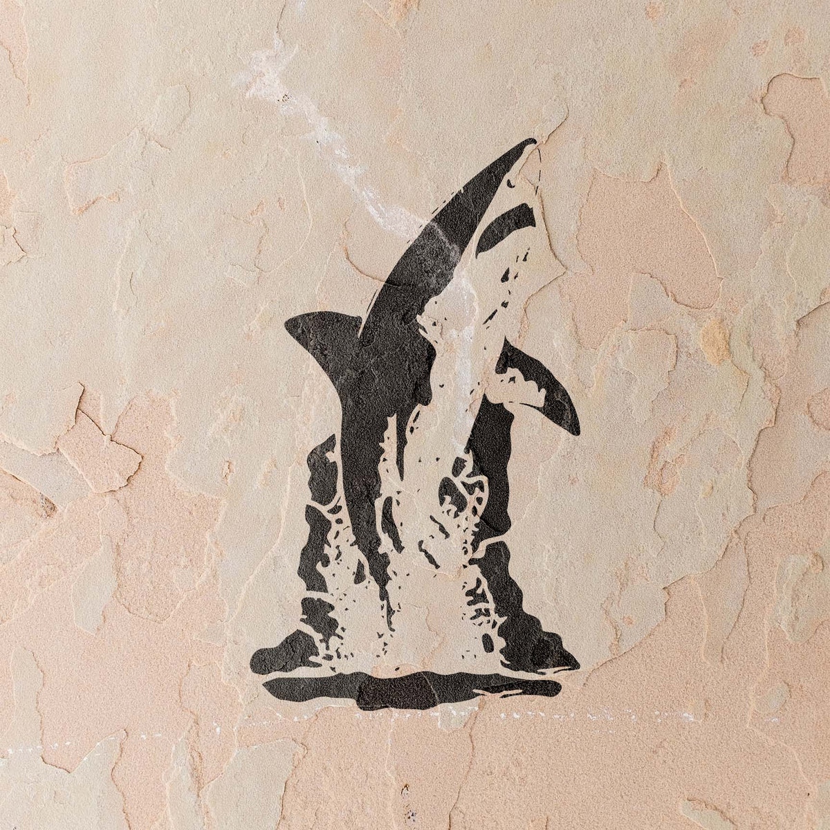 A bold Leaping Great White Shark Stencil emerges from splashing water on a stucco wall