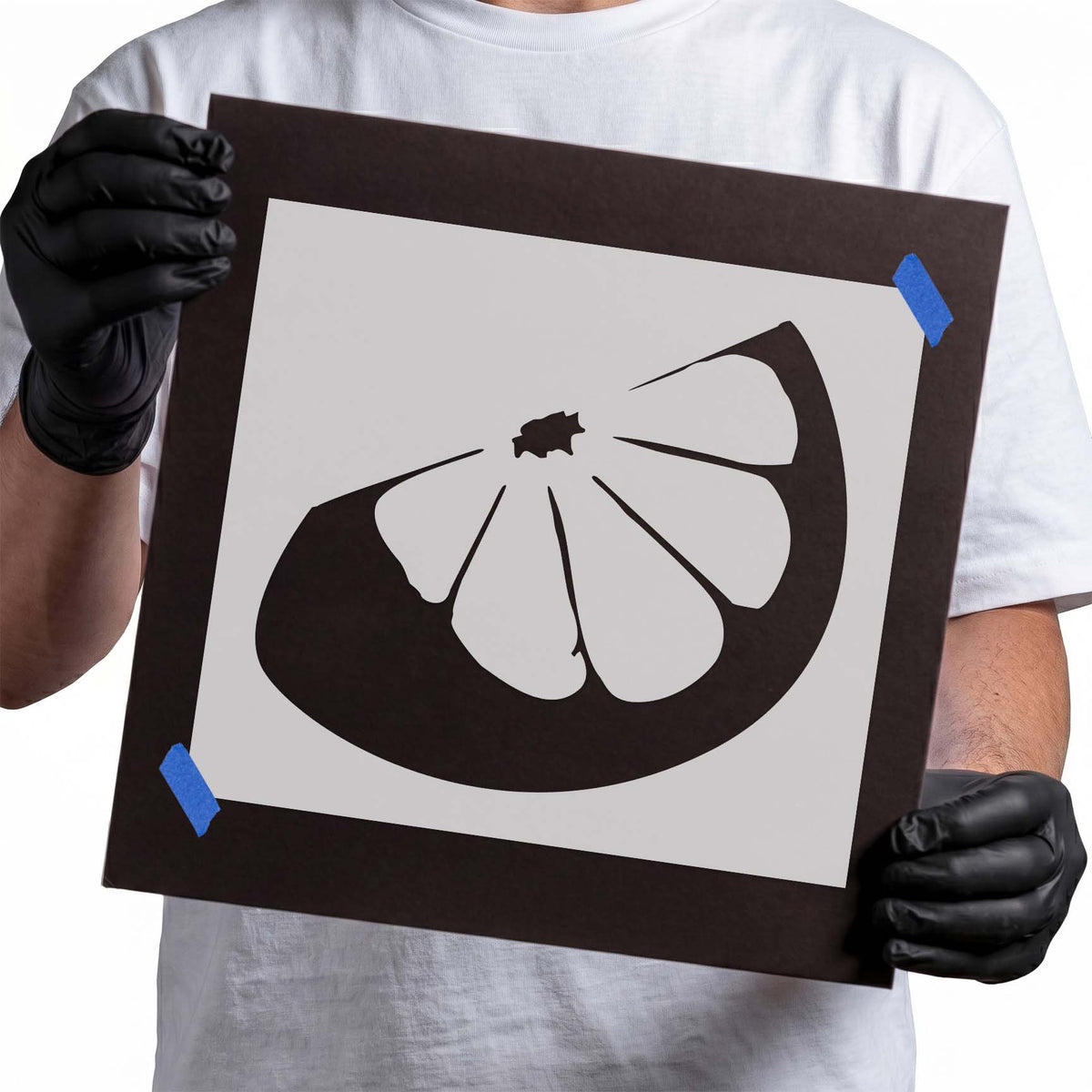 Lemon slice stencil showing six juicy segments framed by a thick curved rind