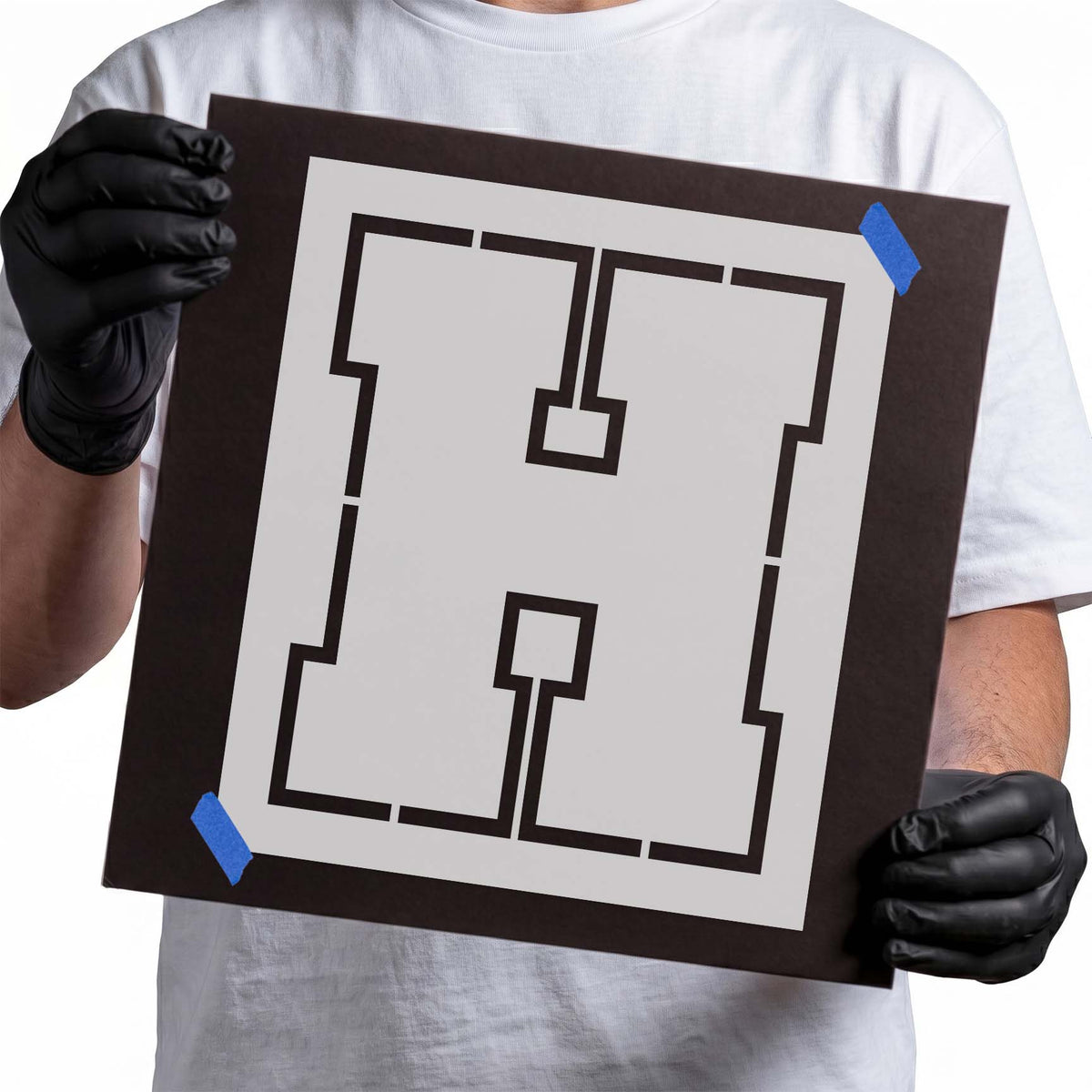 Letter H stencil with bold block shape and geometric bridge cut details