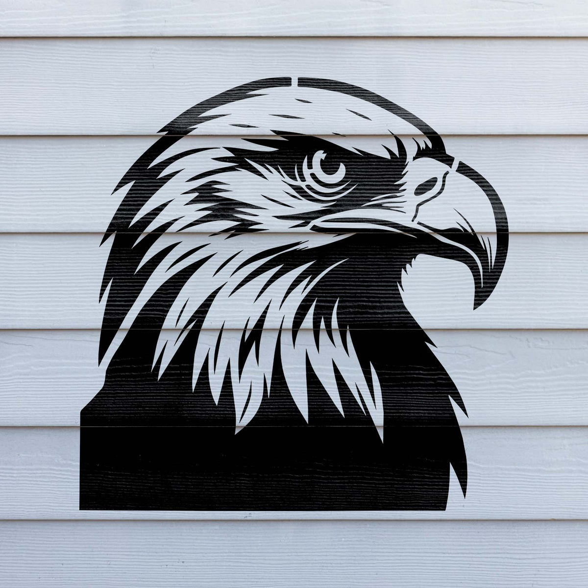 Bold black Majestic Bald Eagle Head Stencil transforms white siding with a detailed eagle profile and curved beak.