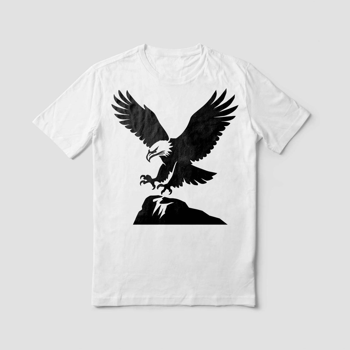 A white T-shirt features the Majestic Eagle Landing Stencil in black with raised wings and extended talons.