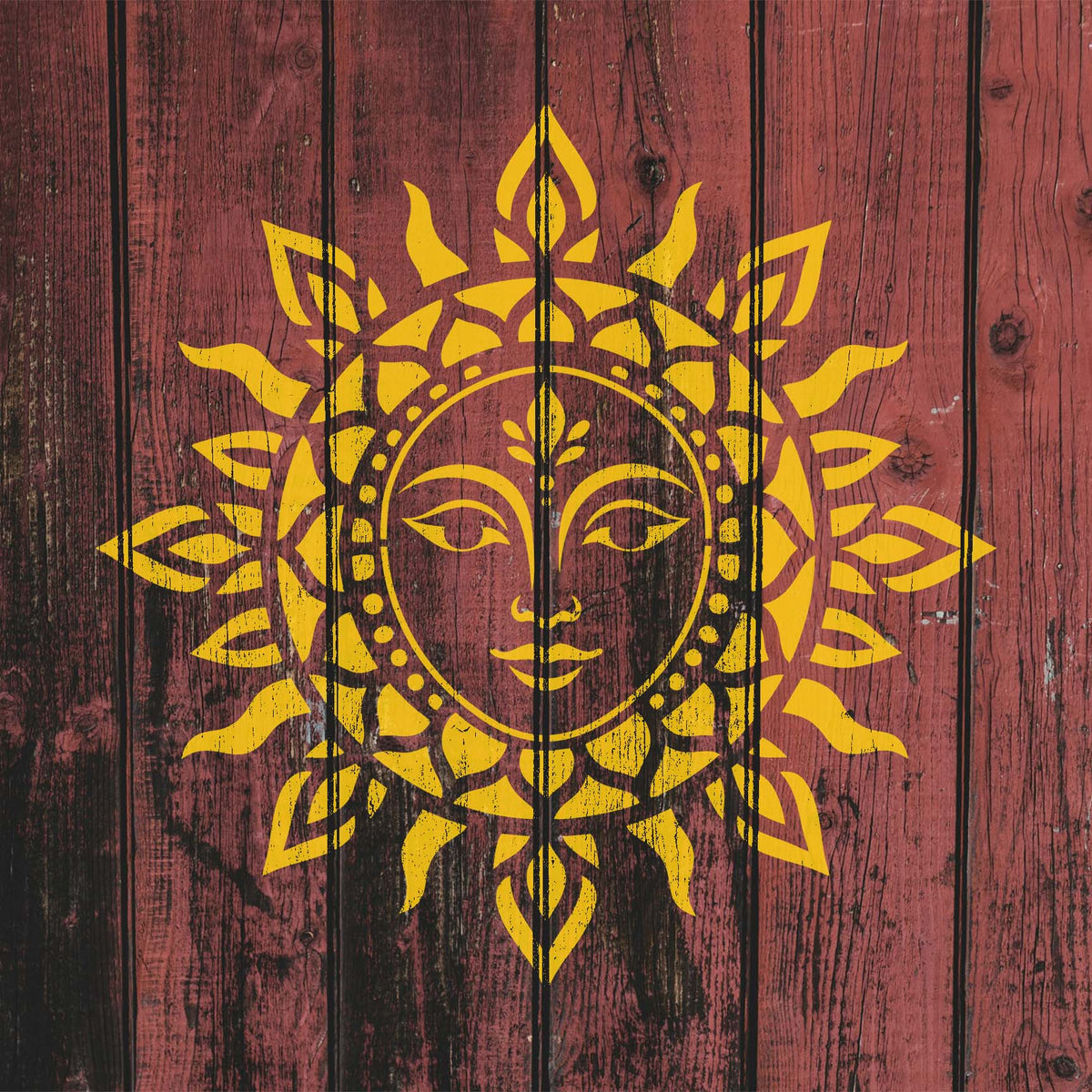 Mandala Sun Face Stencil painted yellow across rustic red wood planks