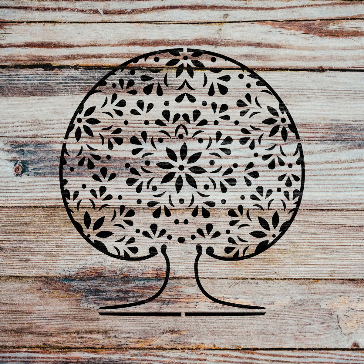 Mandala Tree of Life stencil in black displayed on rustic wood