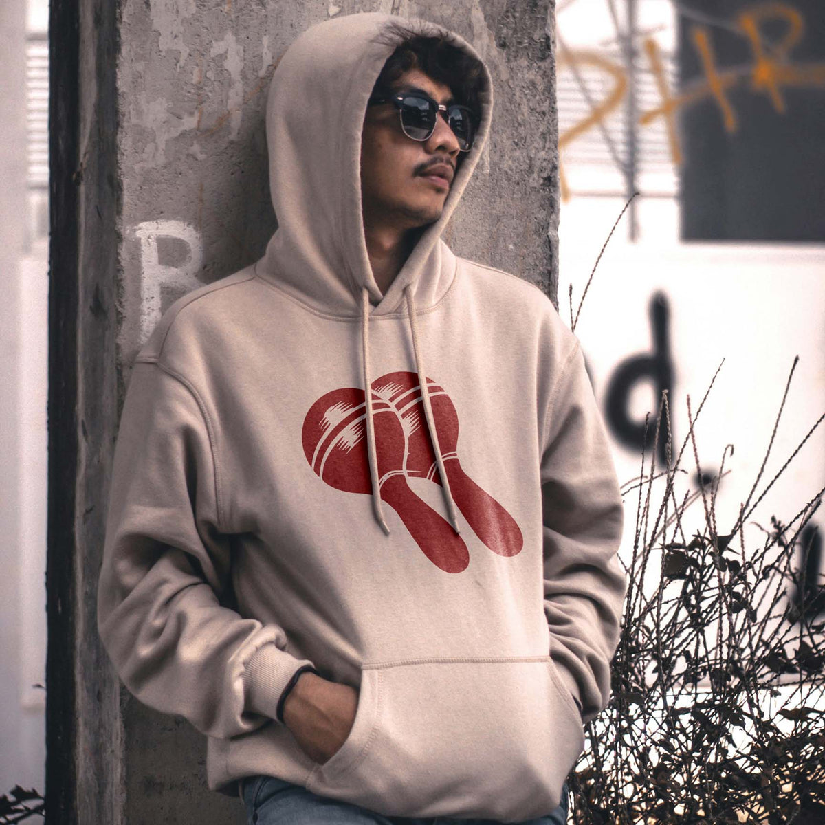 Maracas Stencil adds a striking red musical design to a casual hoodie