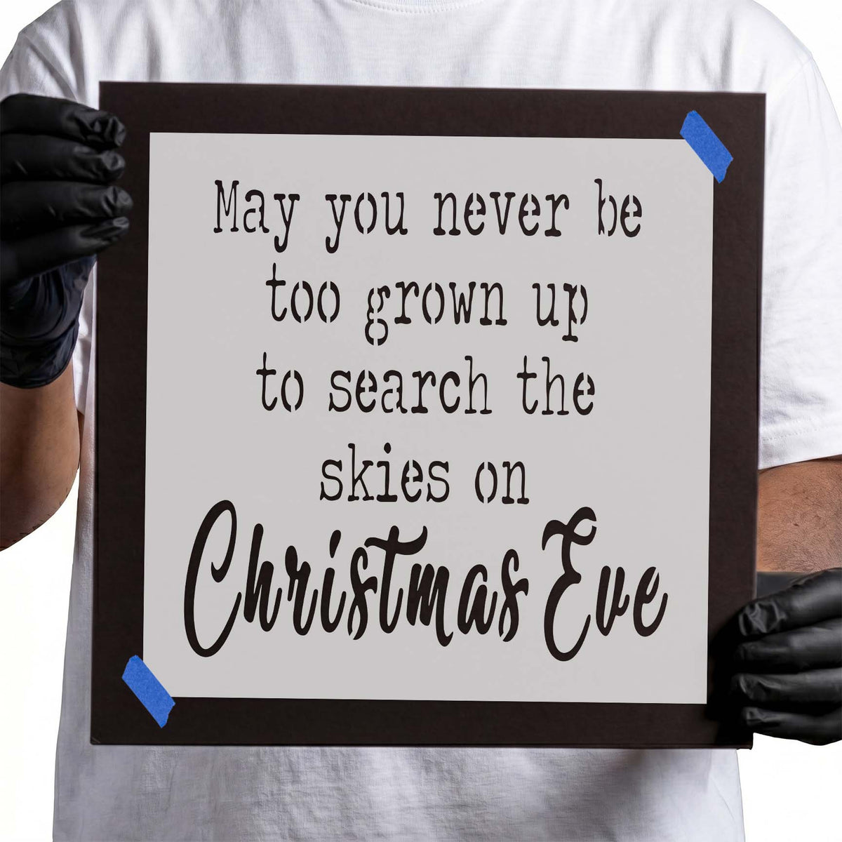 Christmas quote stencil featuring five lines of decorative lettering and oversized Christmas Eve script