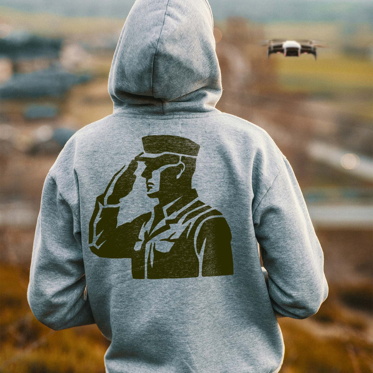 Saluting service member design from the Military Salute Silhouette Stencil displayed on a gray hoodie.