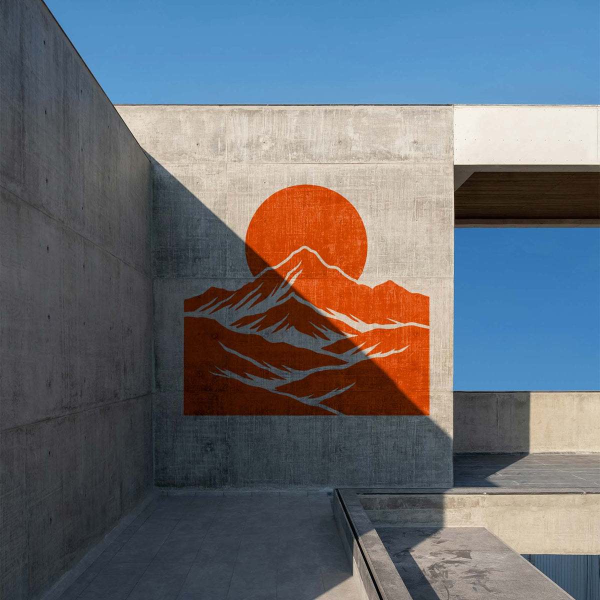 Orange Mountain Moon Landscape Stencil displayed on a modern concrete wall with a rising moon