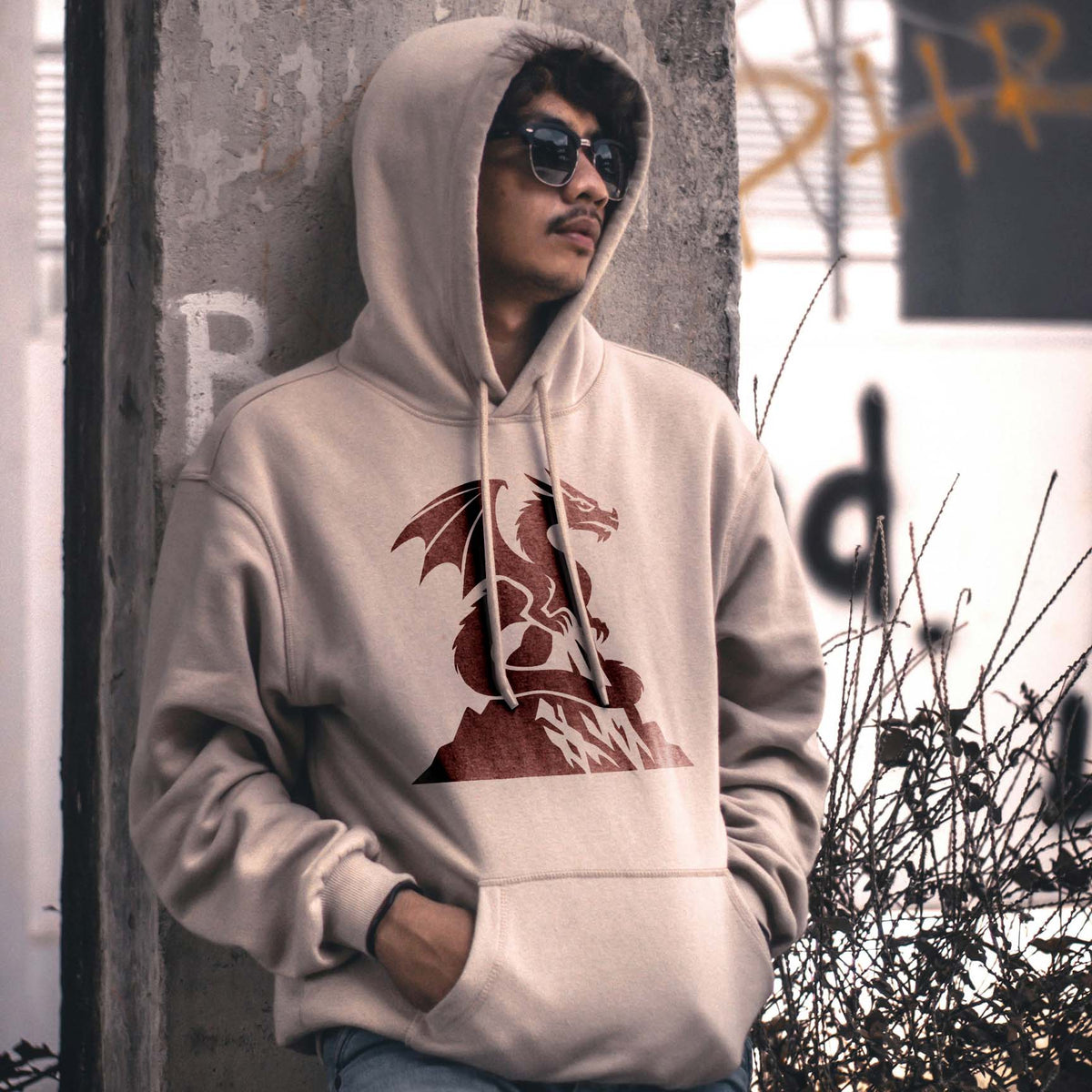 Mountain Peak Dragon Stencil adds a dark red winged dragon design to a beige hoodie