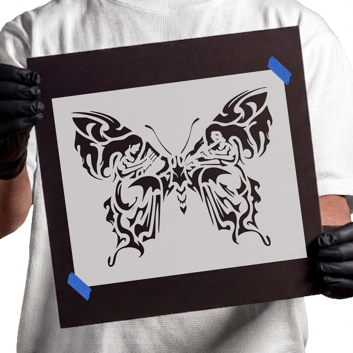 Ornate butterfly stencil with symmetrical wings and flowing decorative details