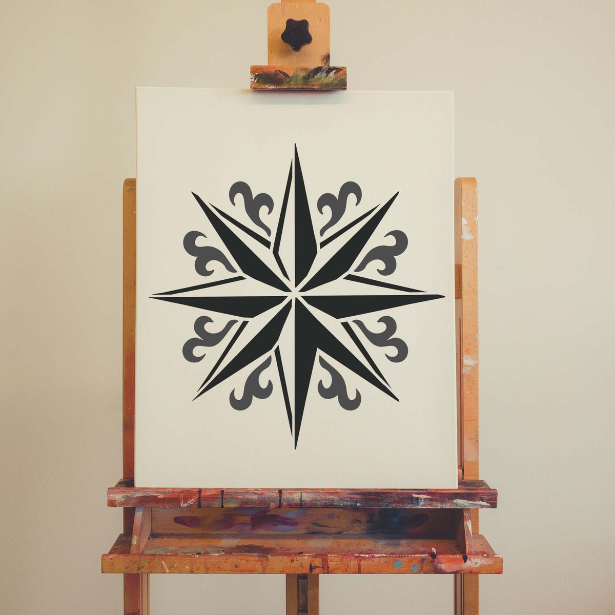 Ornate Compass Star Stencil displayed in black on an artist canvas with elegant flourishes