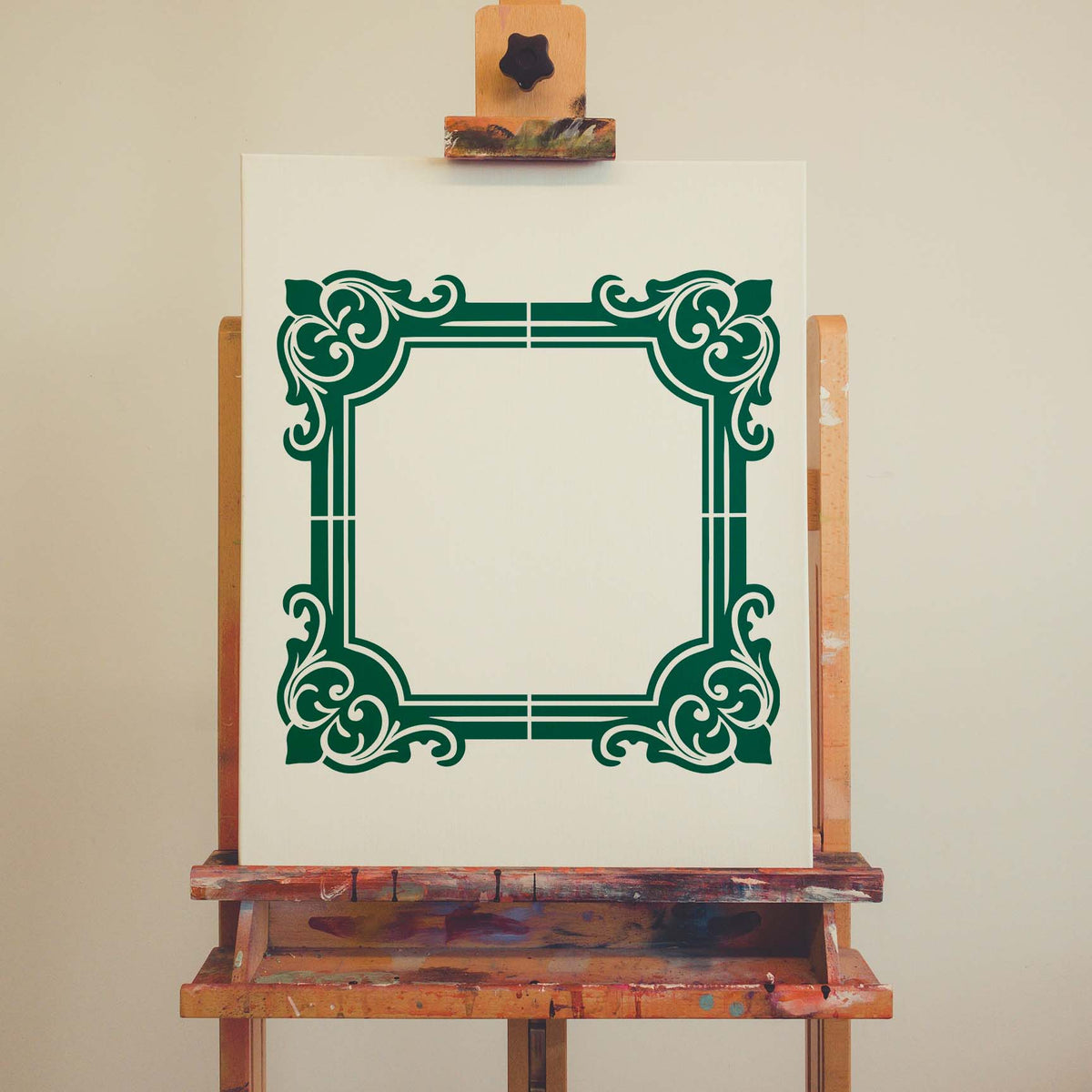Ornate Corner Border Frame Stencil in green with elegant scrollwork displayed on a white canvas