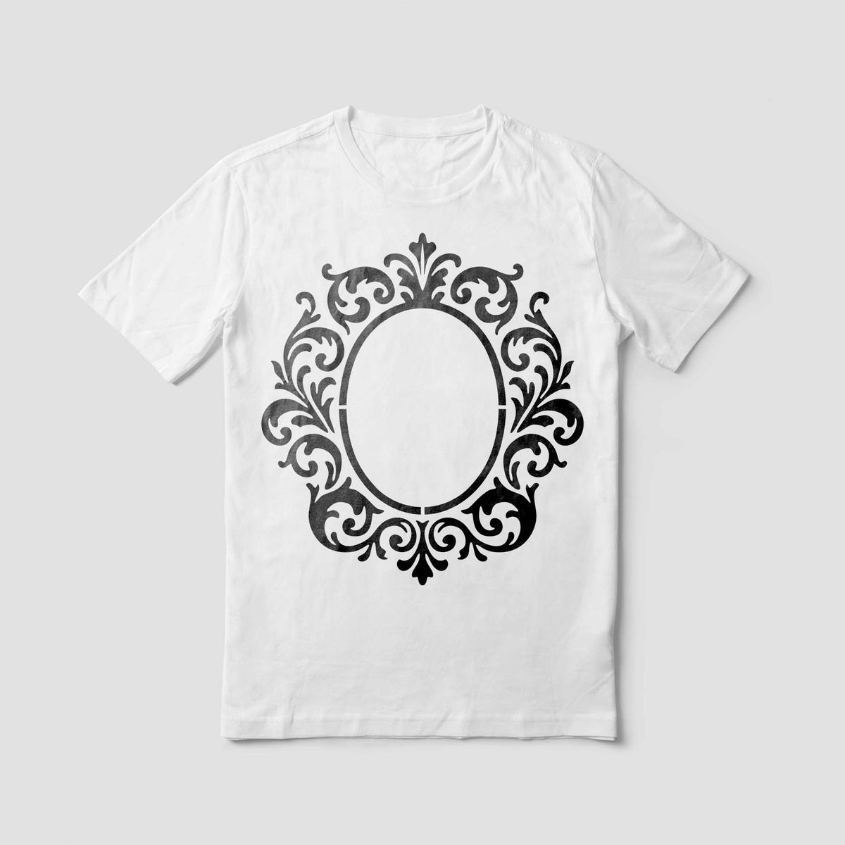A white T-shirt features the Ornate Monogram Frame Stencil with a bold oval floral border