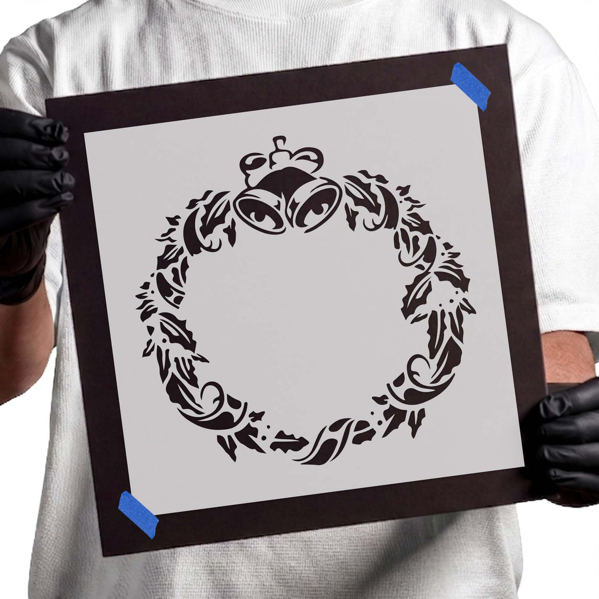 Ornate wreath stencil with twin bells, leafy flourishes and decorative bow