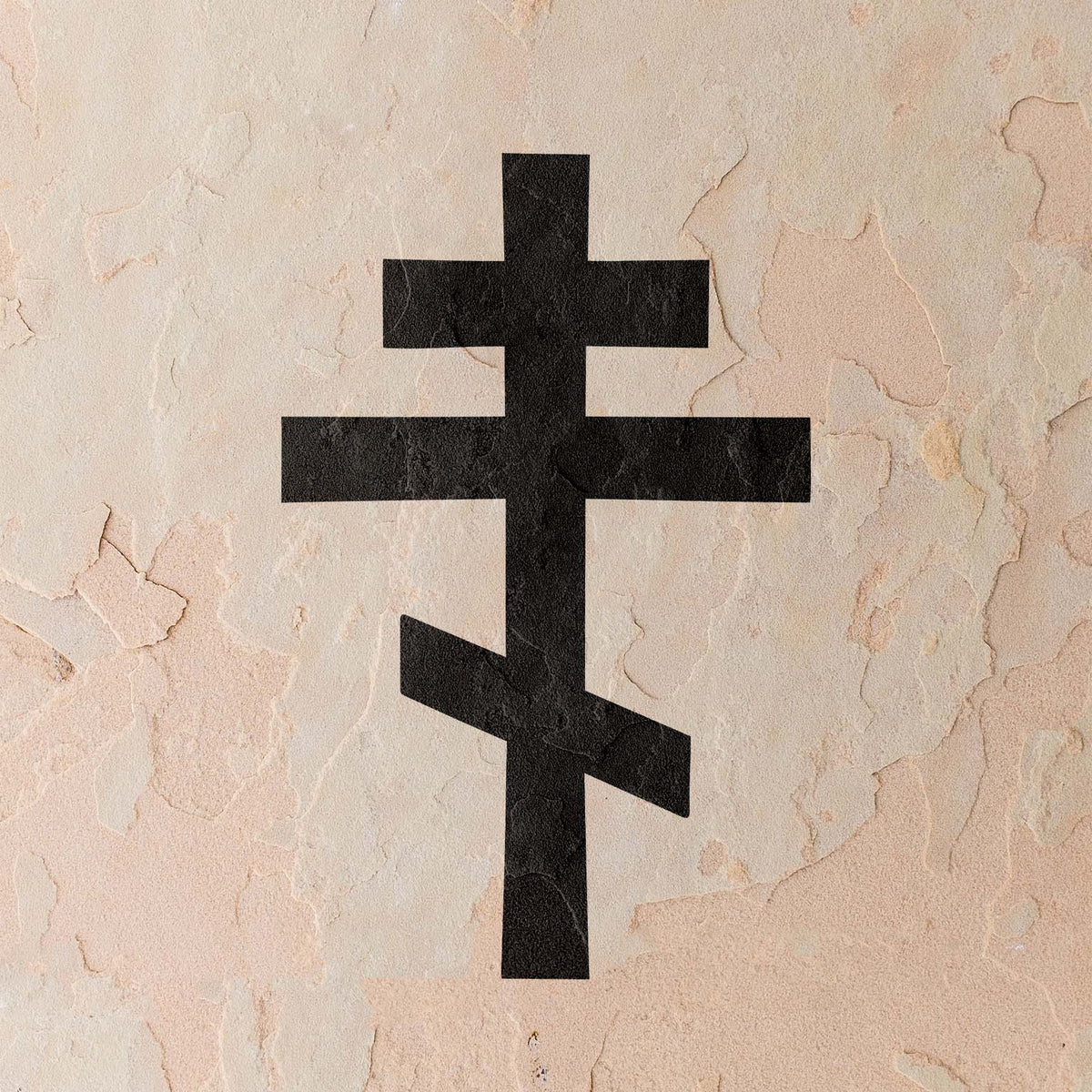 Orthodox Cross Stencil displayed on a light plaster wall with a weathered texture.