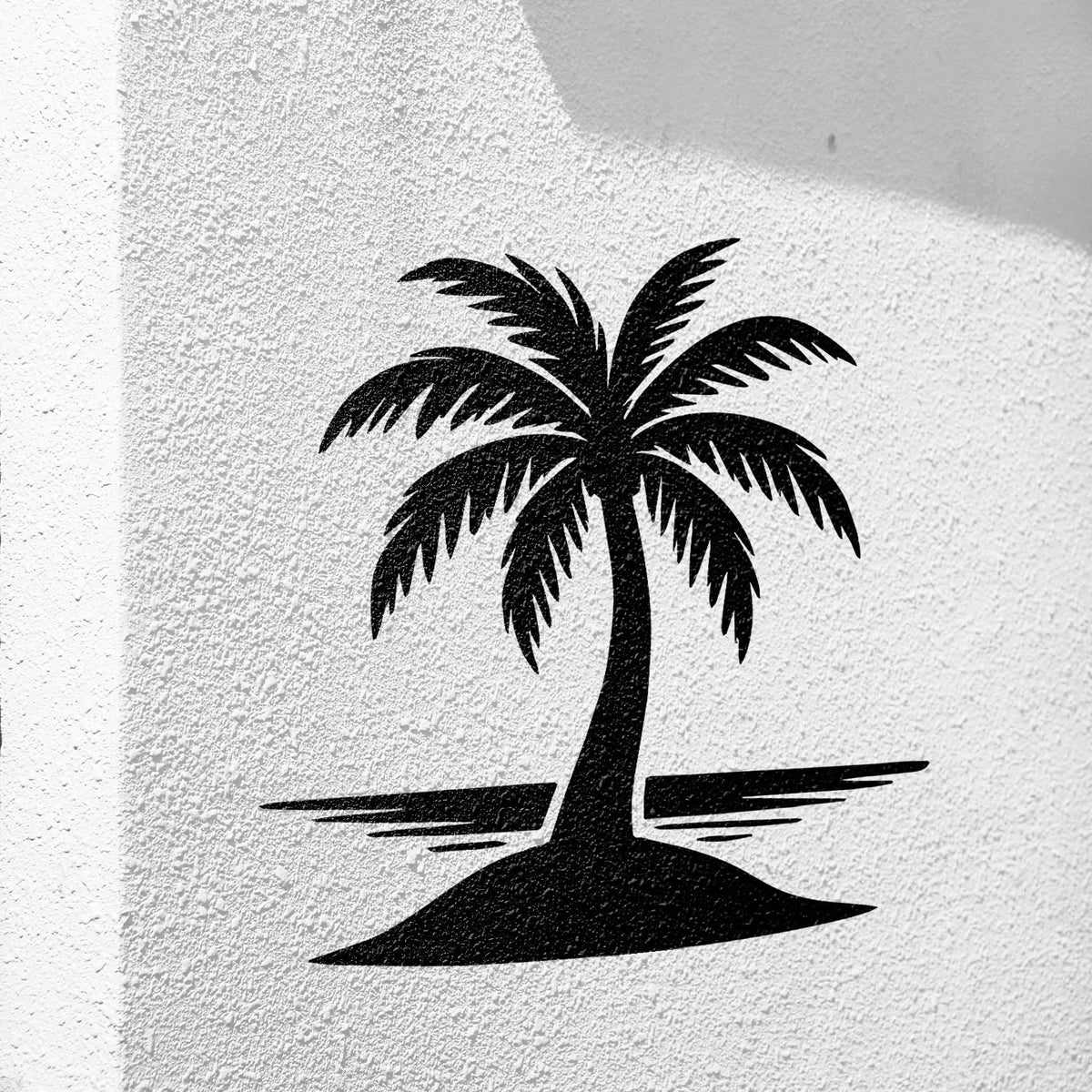 Palm Tree on Island Stencil displayed in black on a textured white wall with coastal scenery