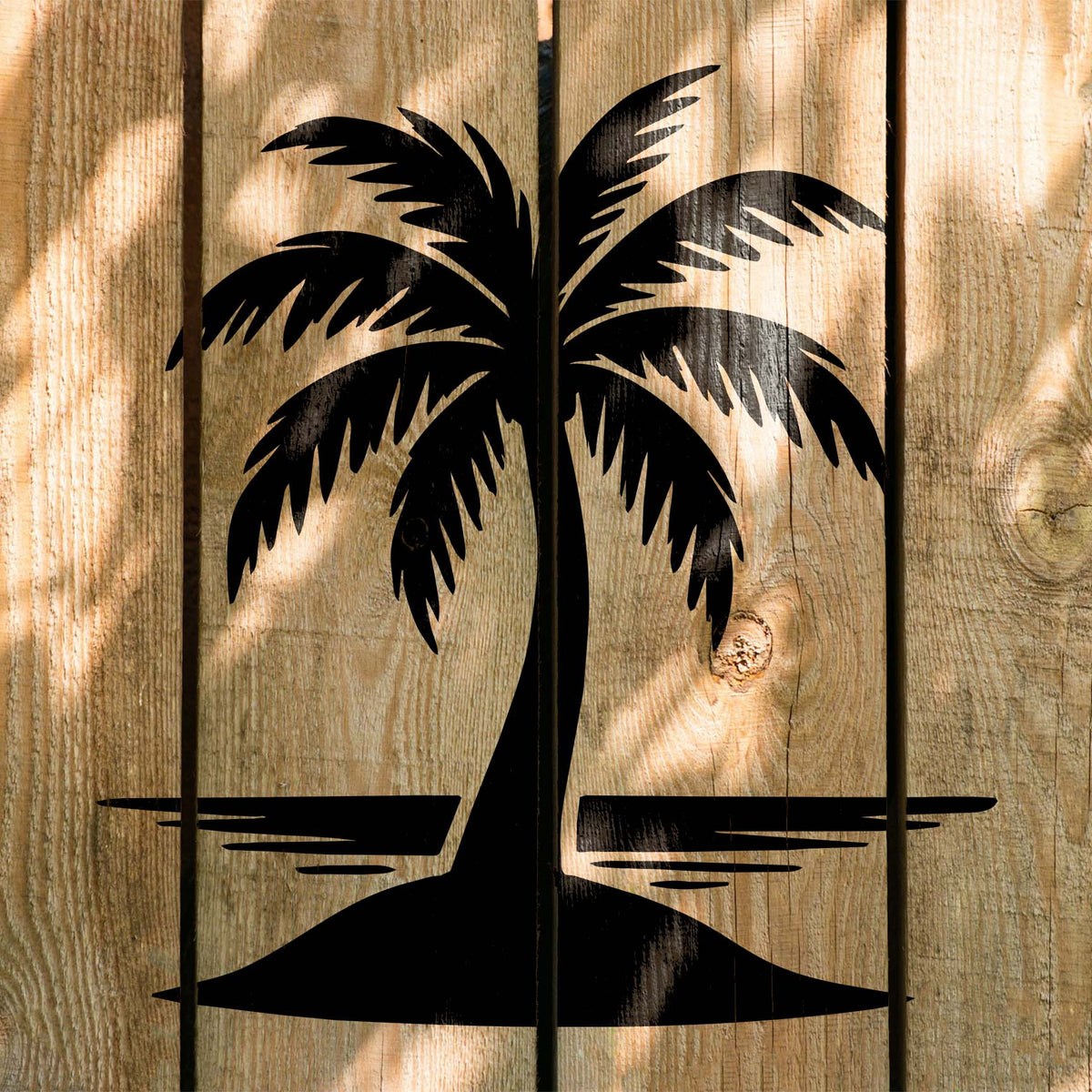 Bold Palm Tree on Island Stencil painted across rustic wood planks with ocean reflection lines