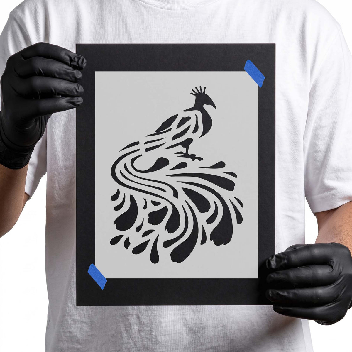Peacock stencil with crested head and sweeping ornamental tail feathers