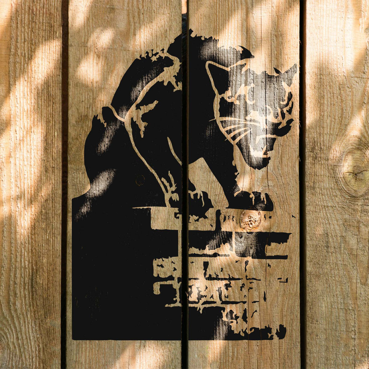 Shadowy Prowling Panther Stencil creeps across rustic wooden fence boards