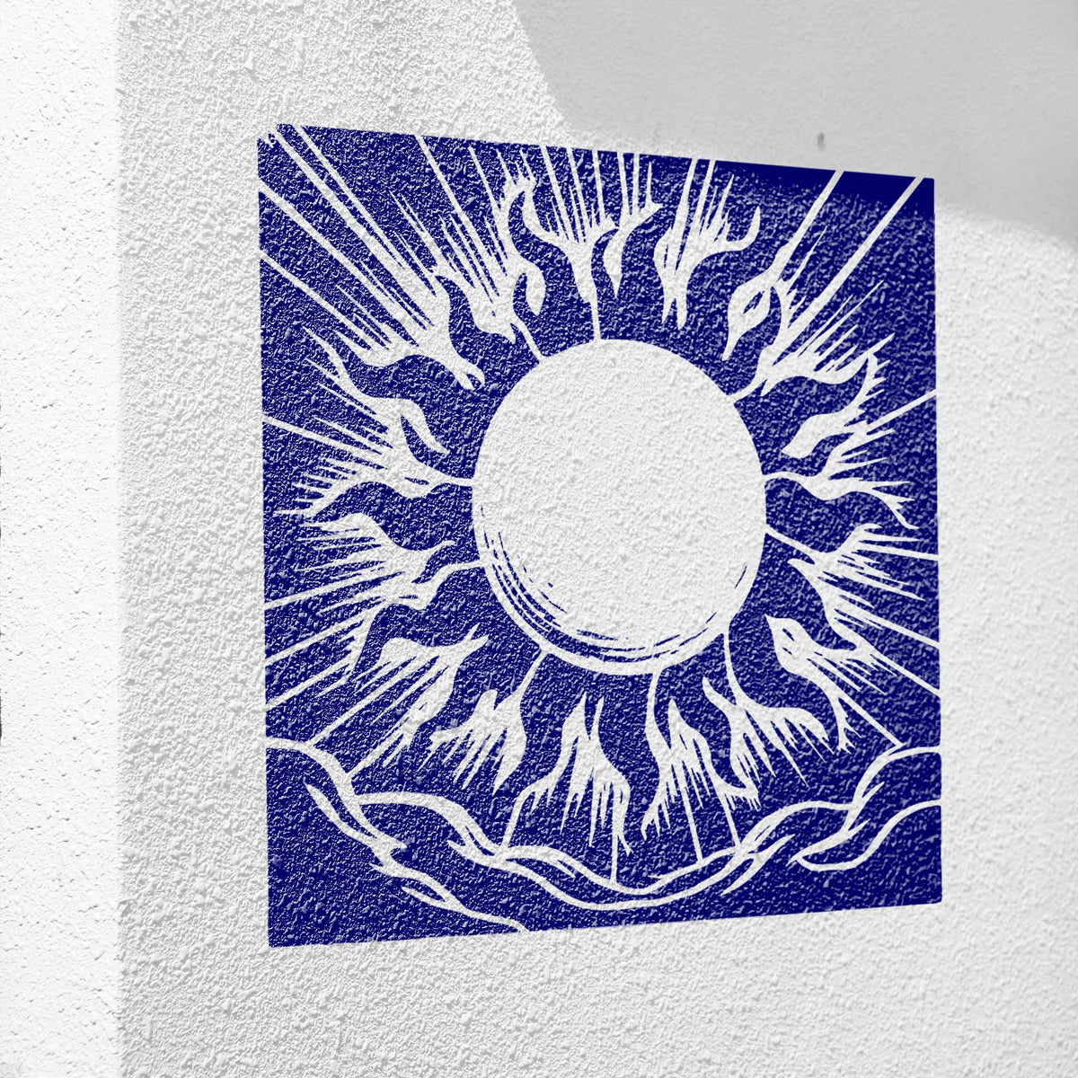 Bold blue Radiant Solar Halo Stencil displayed across a textured white wall