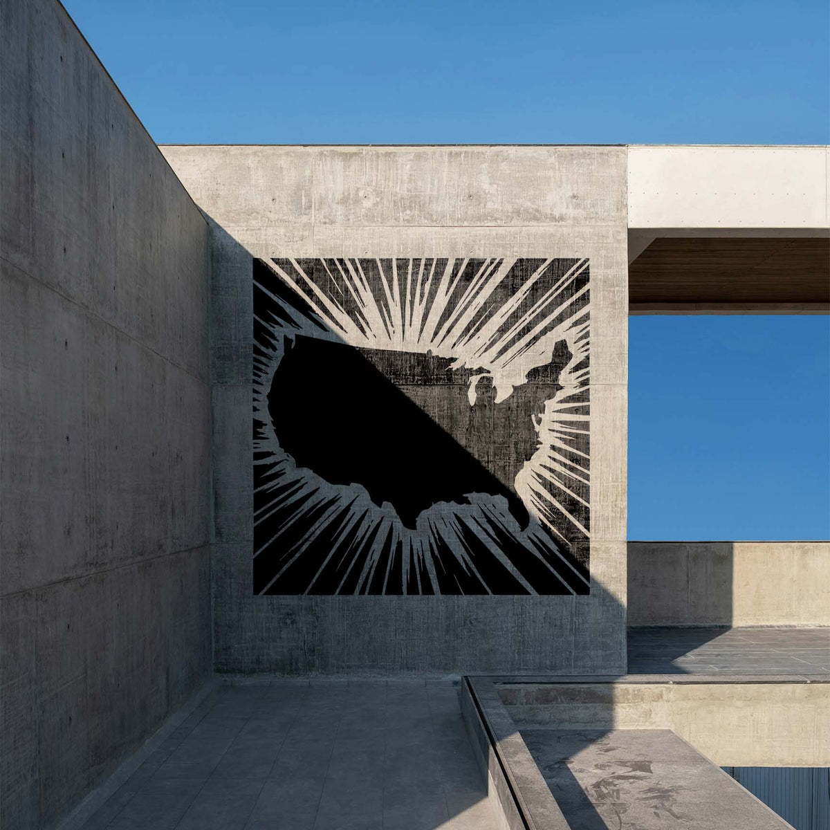 Radiant USA Map Stencil spans a concrete wall with bold rays around the United States