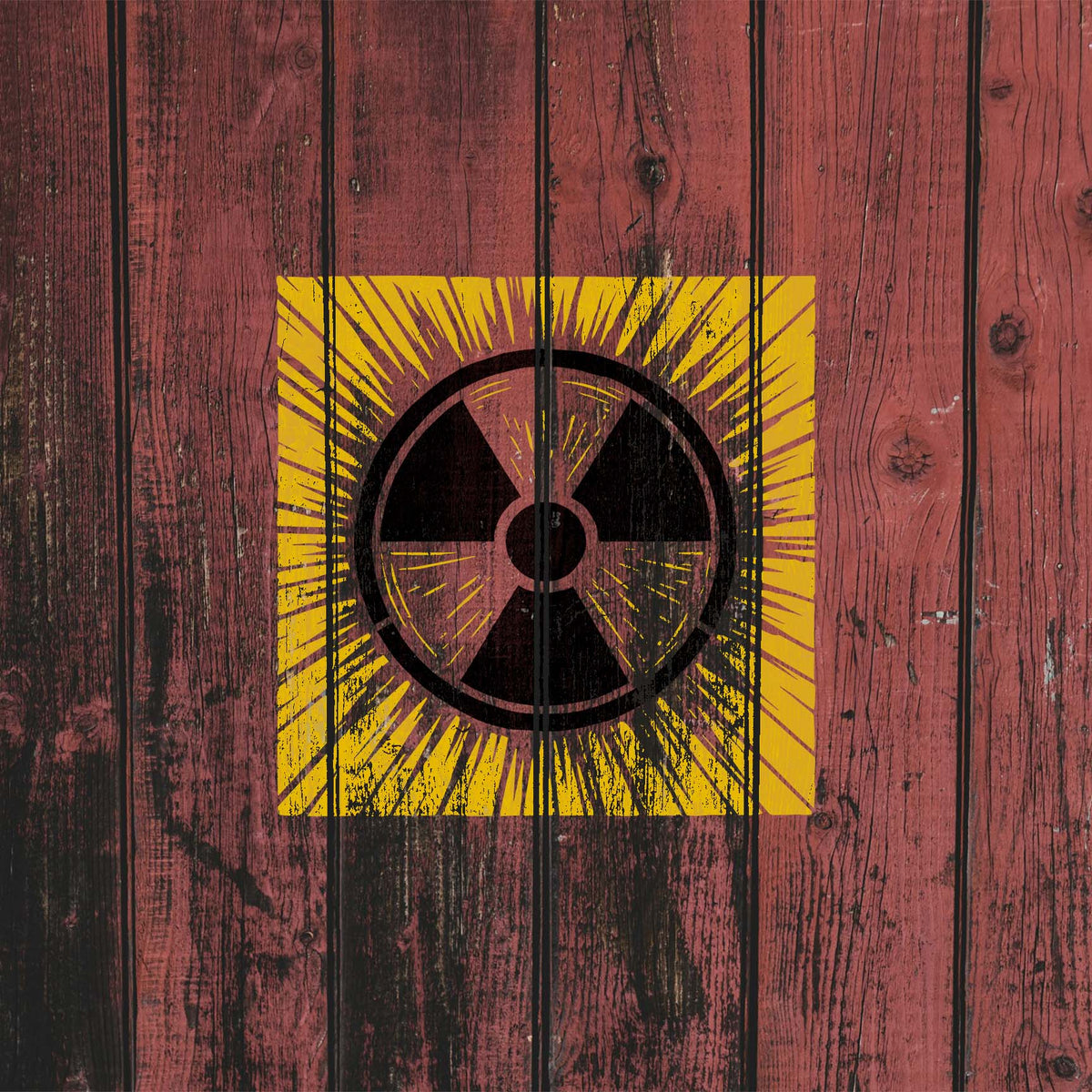 Weathered red wood showcases the Radiation Warning Symbol Stencil with a vivid yellow burst