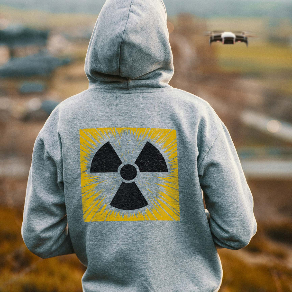 Bold Radiation Trefoil Burst Symbol Stencil graphic displayed across the back of a gray hoodie