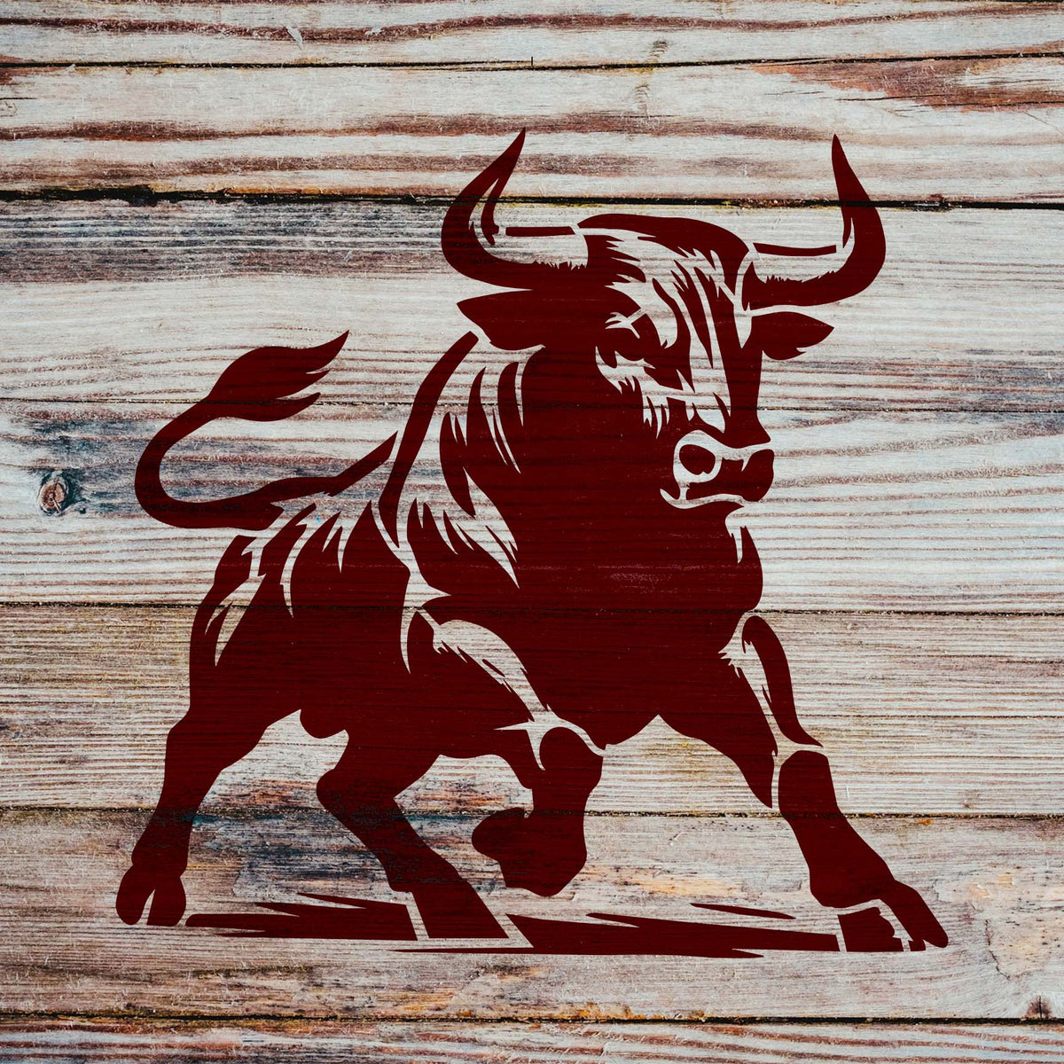 Against wooden planks, the Raging Bull Stencil features a red bull with raised horns and striking hooves.