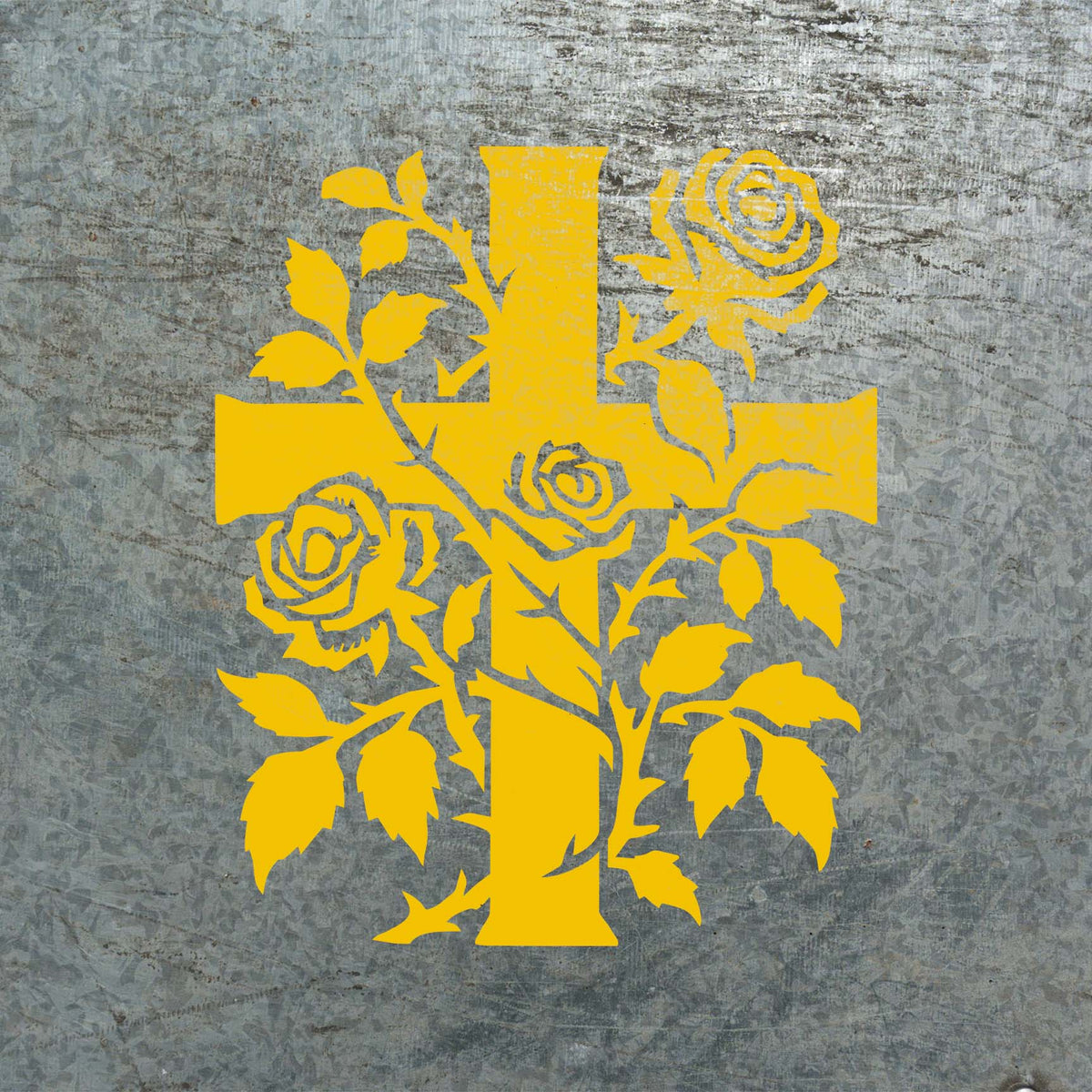 Bright Rose Vine Cross Stencil pairs a bold cross with blooming roses on a weathered metal surface